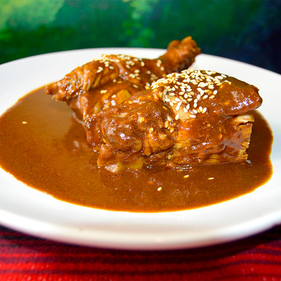 Chicken served in a rich traditional mole poblano sauce